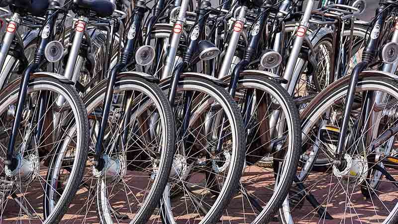 Multiple bicycles stading in a row