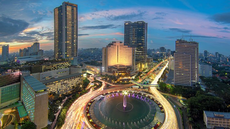 The Hotel Indonesia Roundabout Sunset - the most iconic spot in Jakarta - Indonesia, surrounded by business district and shopping mall.