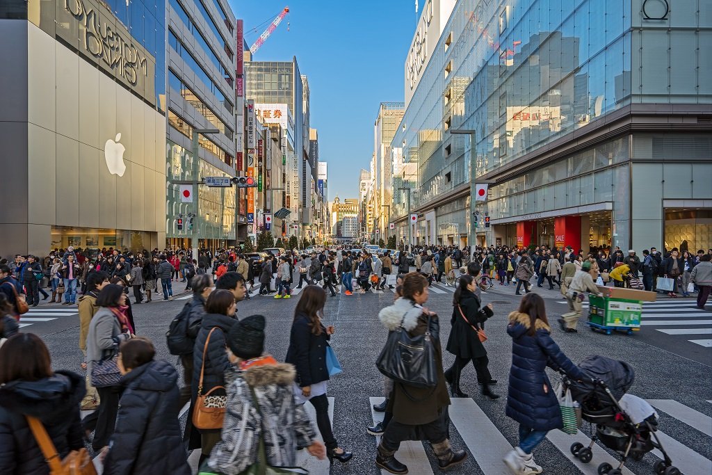 TOKYO, JAPAN - CIRCA JANUARY, 2016: The shopping Ginza district with the famous Chuo Dori that closes to cars on Sundays and becomes a pedestrian street, circa January, 2016 Tokyo.; Shutterstock ID 404430784