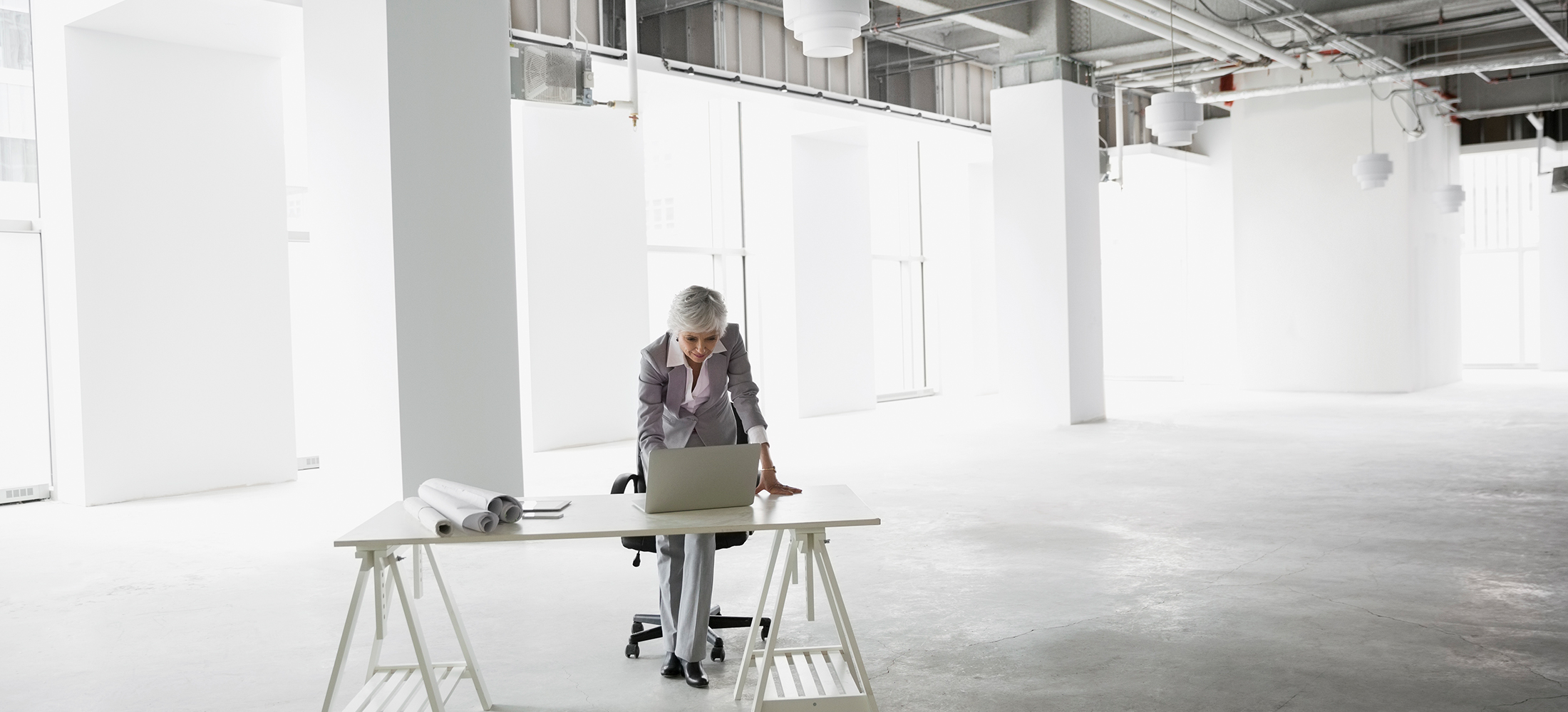 Architect working at laptop in empty office